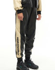 THE VIRALIZER UNISEX LEATHER TRACKSUIT BOTTOMS IN BLACK AND CREAM