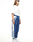 THE VIRALIZER UNISEX LEATHER TRACKSUIT BOTTOMS IN WHITE AND ROYAL BLUE