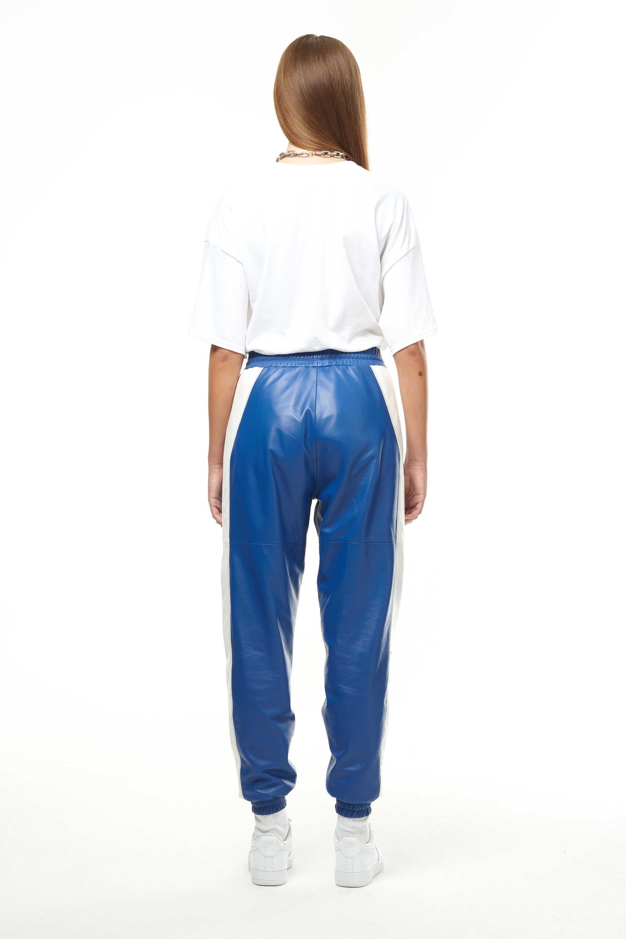 THE VIRALIZER UNISEX LEATHER TRACKSUIT BOTTOMS IN WHITE AND ROYAL BLUE