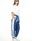 THE VIRALIZER UNISEX LEATHER TRACKSUIT BOTTOMS IN WHITE AND ROYAL BLUE
