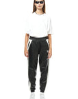 THE VIRALIZER UNISEX LEATHER TRACKSUIT BOTTOMS IN BLACK AND WHITE