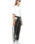 THE VIRALIZER UNISEX LEATHER TRACKSUIT BOTTOMS IN BLACK AND WHITE