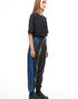 THE VIRALIZER UNISEX LEATHER TRACKSUIT BOTTOMS IN BLACK AND ROYAL BLUE