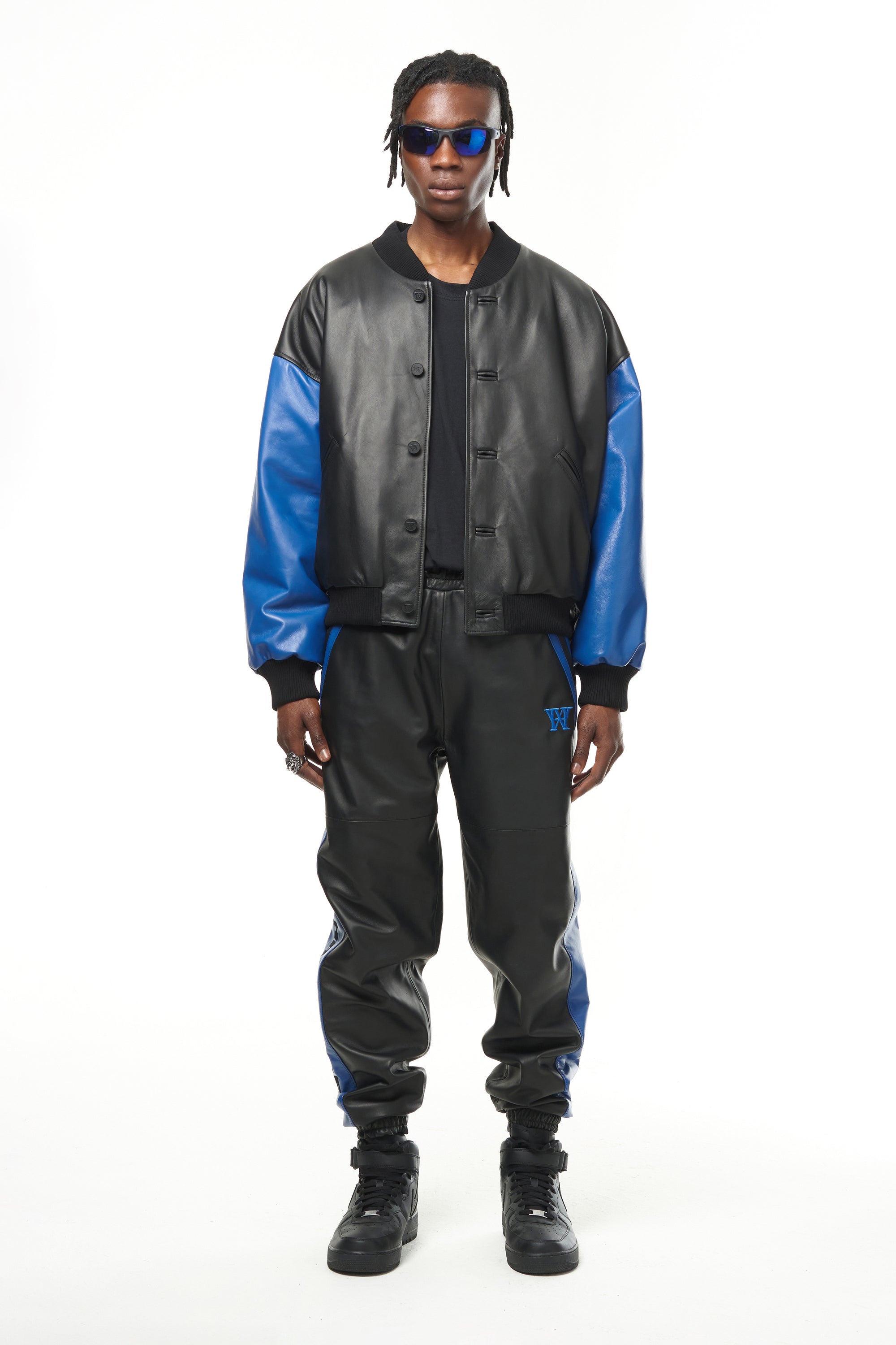 THE VIRALIZER UNISEX LEATHER TRACKSUIT BOTTOMS IN BLACK AND ROYAL BLUE