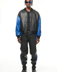 THE VIRALIZER UNISEX LEATHER TRACKSUIT BOTTOMS IN BLACK AND ROYAL BLUE