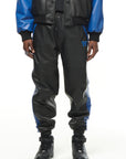 THE VIRALIZER UNISEX LEATHER TRACKSUIT BOTTOMS IN BLACK AND ROYAL BLUE