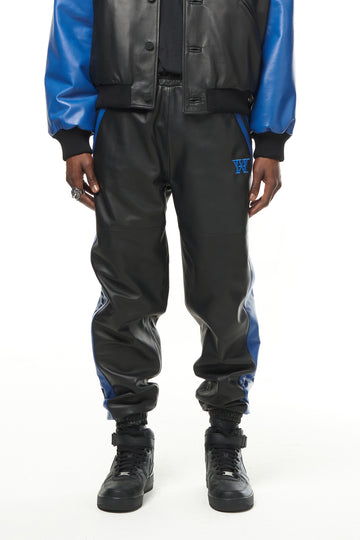 THE VIRALIZER UNISEX LEATHER TRACKSUIT BOTTOMS IN BLACK AND ROYAL BLUE