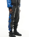 THE VIRALIZER UNISEX LEATHER TRACKSUIT BOTTOMS IN BLACK AND ROYAL BLUE