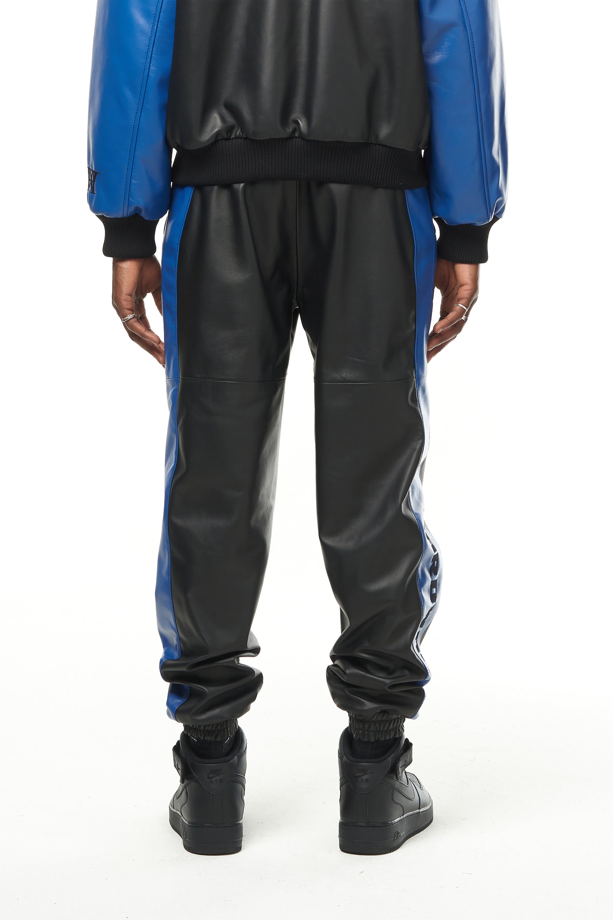 THE VIRALIZER UNISEX LEATHER TRACKSUIT BOTTOMS IN BLACK AND ROYAL BLUE