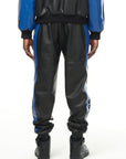 THE VIRALIZER UNISEX LEATHER TRACKSUIT BOTTOMS IN BLACK AND ROYAL BLUE